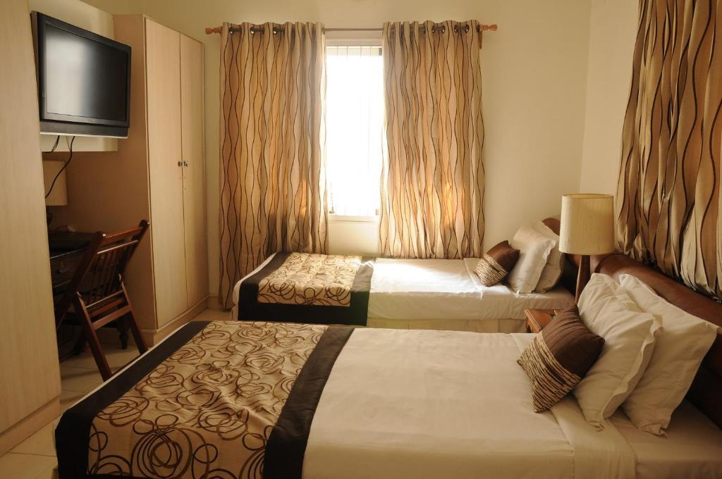 צ'נאי Executive Comfort Alwarpet חדר תמונה